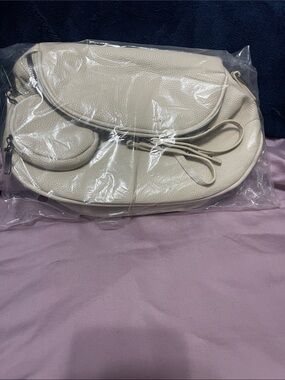Pebbled Cream Crossbody Saddle Bag with Bow Accent